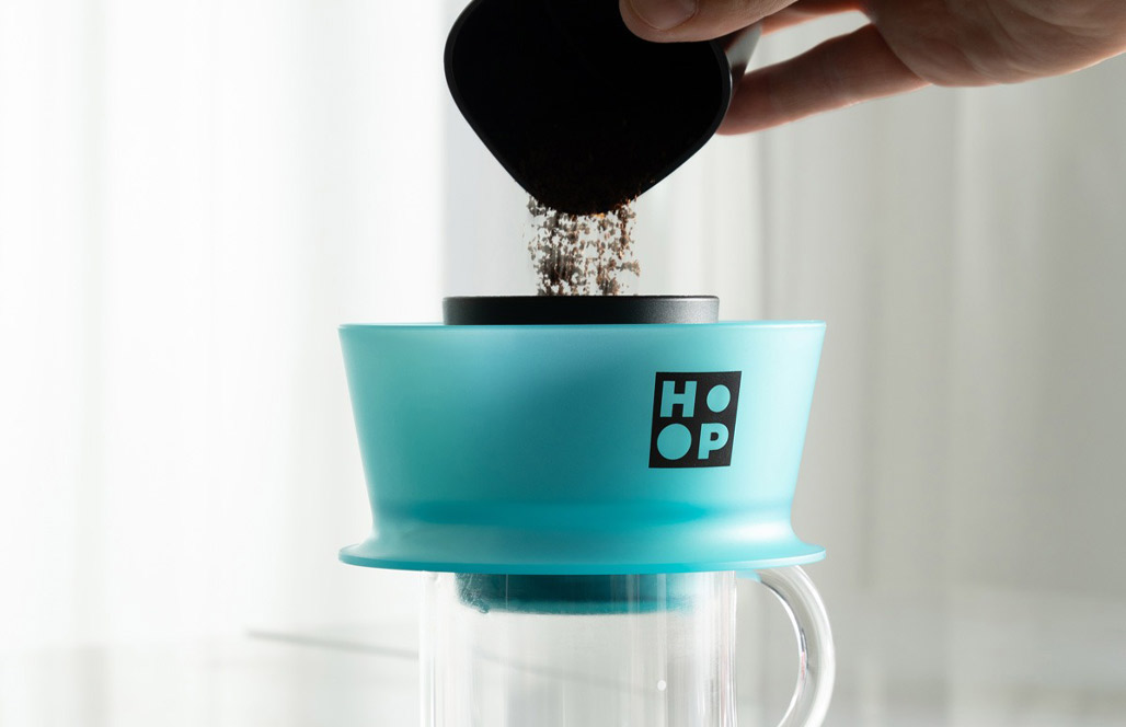 Dosing ground coffee into the Hoop brewer